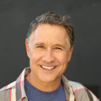 Man smiling with a dental crown