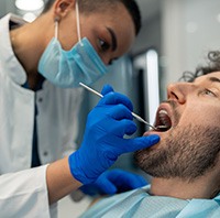 A man receiving scaling and root planing